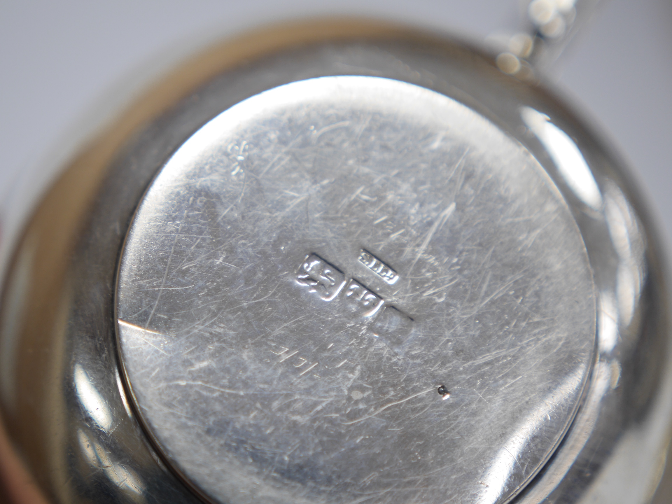 A late Victorian silver porringer, London, 1897, height 61mm, an Edwardian silver porringer, a late Victorian repousse silver sugar bowl and a George V silver cream jug by Hukin & Heath, 17.1oz. Condition - poor to fair